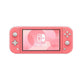 Front view of the coral-pink Nintendo Switch Lite displaying the Switch logo on its 5.5-inch screen, isolated on white.