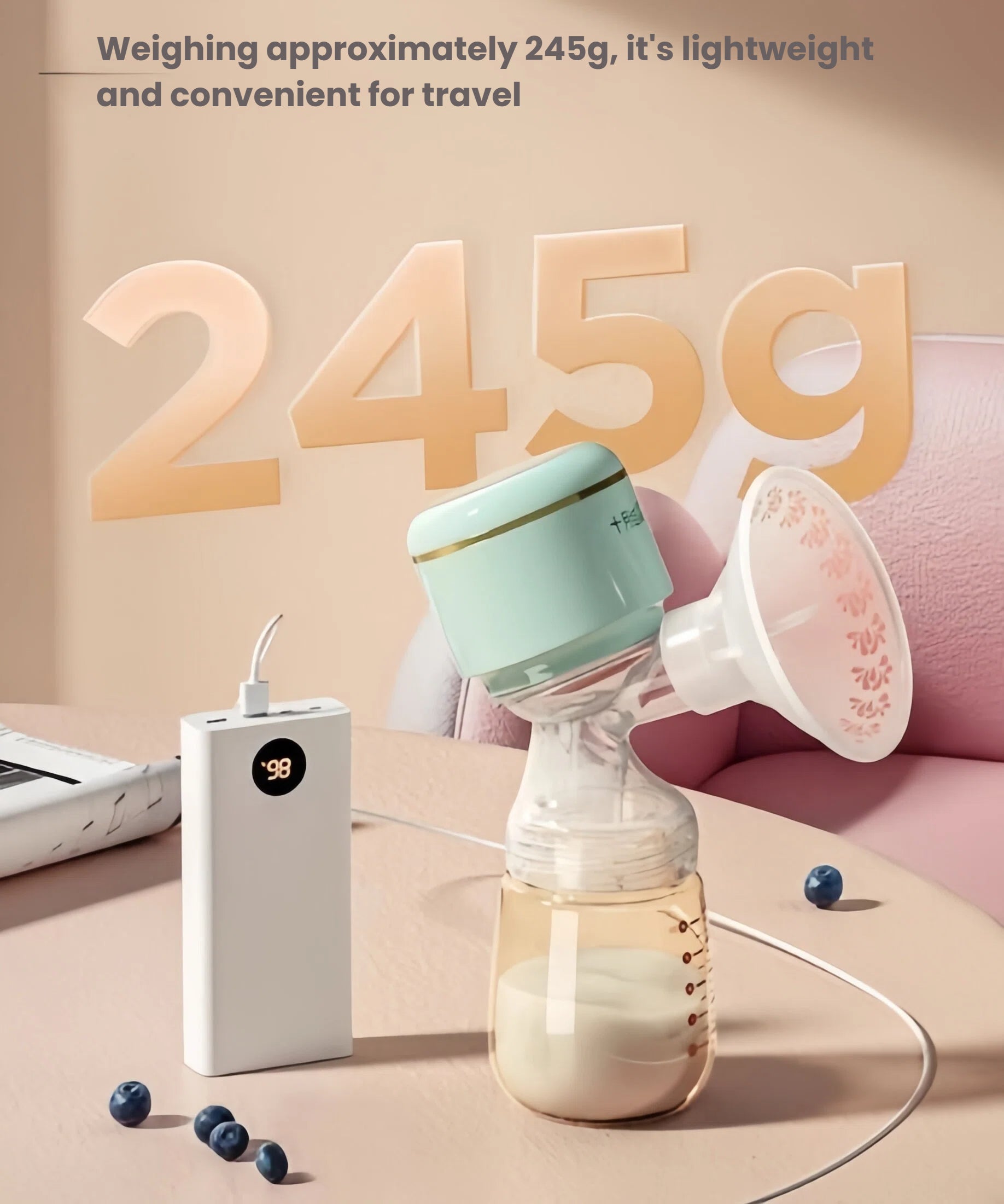 October Crystal portable breast pump weighing 245g displayed next to a power bank; USB-C charging cable connected, showing compatibility with laptops, adapters, and portable chargers