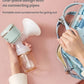 Hand placing October Crystal all-in-one breast pump into a diaper bag; compact one-piece design with no hoses or tubes, perfect for travel and on-the-go pumping