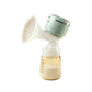October Crystal wearable breast pump in mint green color; sleek all-in-one design with touch control panel, silicone massage flange, and 180ml milk bottle showing collected breast milk