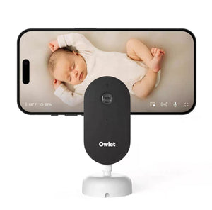 Owlet Dream Sight baby monitor camera showing live HD video feed of a sleeping newborn on smartphone screen with temperature and humidity displayed