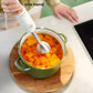 Philips Avent handheld blender used one-handed to blend cooked pumpkin cubes directly in pot—no need to transfer, reducing mess and saving time.