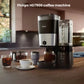 Philips HD7900 coffee machine placed on a wooden countertop in a modern kitchen setting, surrounded by various coffee cups