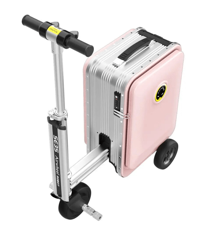 A pink Airwheel SE3S smart suitcase with an integrated handlebar and wheels, designed for riding. The suitcase features the Airwheel logo on the front and is equipped with a compact electric motor for easy mobility
