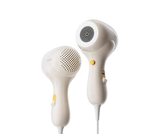 Side-by-side view of SKULD baby hair dryer wireless and wired versions; both feature sleek white design, ergonomic grip, and baby-safe materials