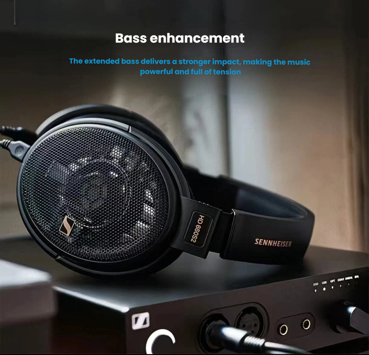 Sennheiser HD 660 S2 over-ear headphones resting on an amplifier, emphasizing extended bass enhancement that delivers deep, impactful low frequencies.