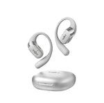 Silver Shokz OpenFit 2+ open-ear headphones floating above its sleek charging case — featuring ergonomic design, lightweight build, and premium finish for active users.