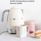 The Smeg KLF04 50's Style Temperature Control Electric Kettle in a cream finish, displayed next to a mug and pastry to showcase its elegant retro design for any stylish kitchen.
