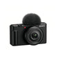 Front view of black Sony ZV-1F 4K vlog camera with 20 mm f/2.0 Zeiss lens and windscreen.