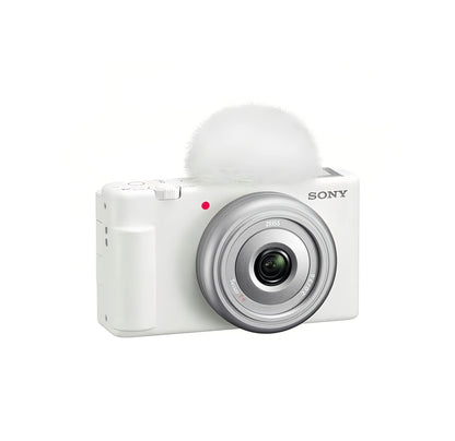 Front view of white Sony ZV-1F 4K vlog camera featuring 20 mm f/2.0 Zeiss lens and built-in windscreen.