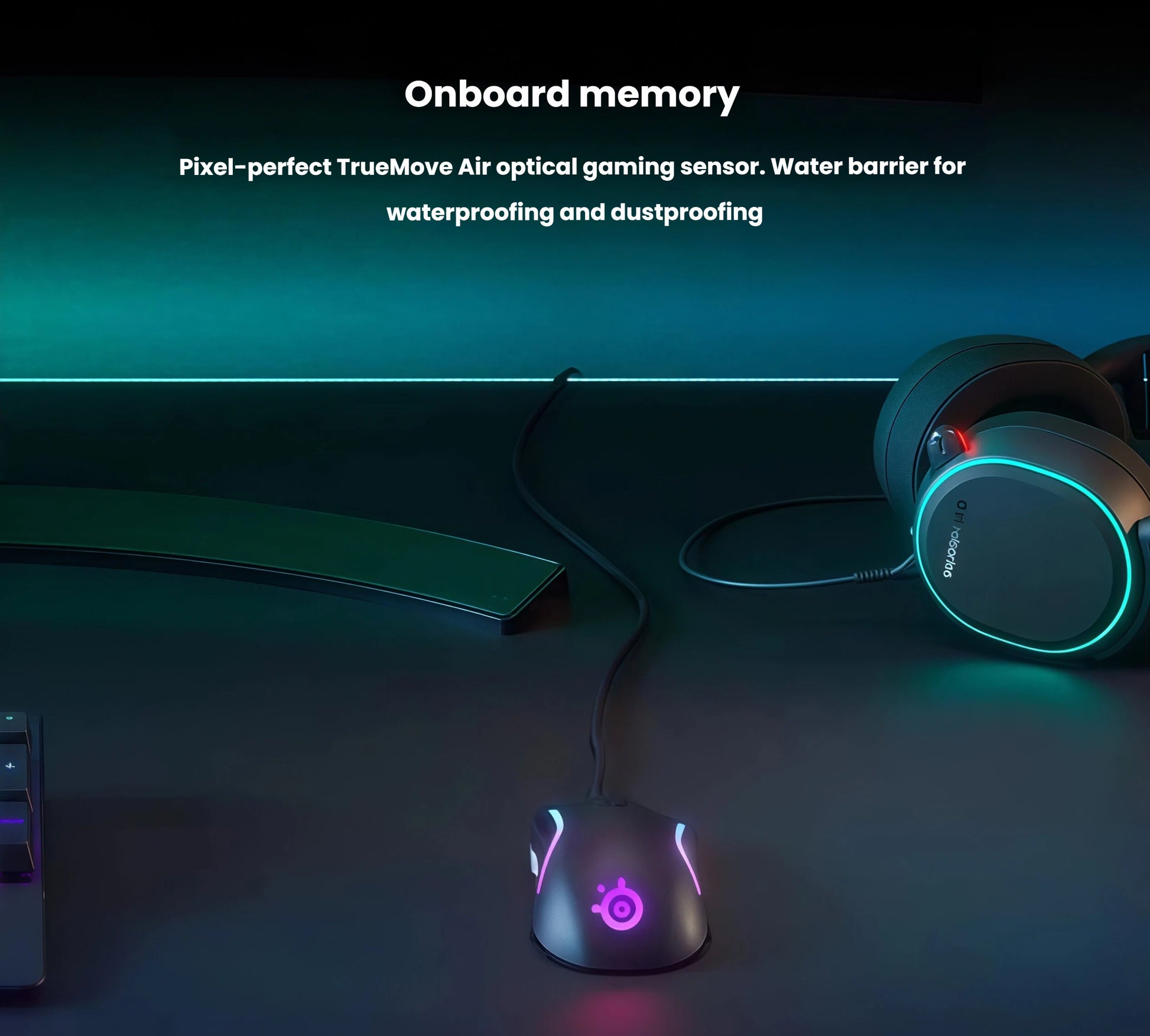 The SteelSeries Rival 5 gaming mouse placed on a dark desk next to a matching RGB keyboard and gaming headset. The mouse features pixel-perfect TrueMove Air optical sensor with water and dust barrier protection, ideal for long gaming sessions in any environment.