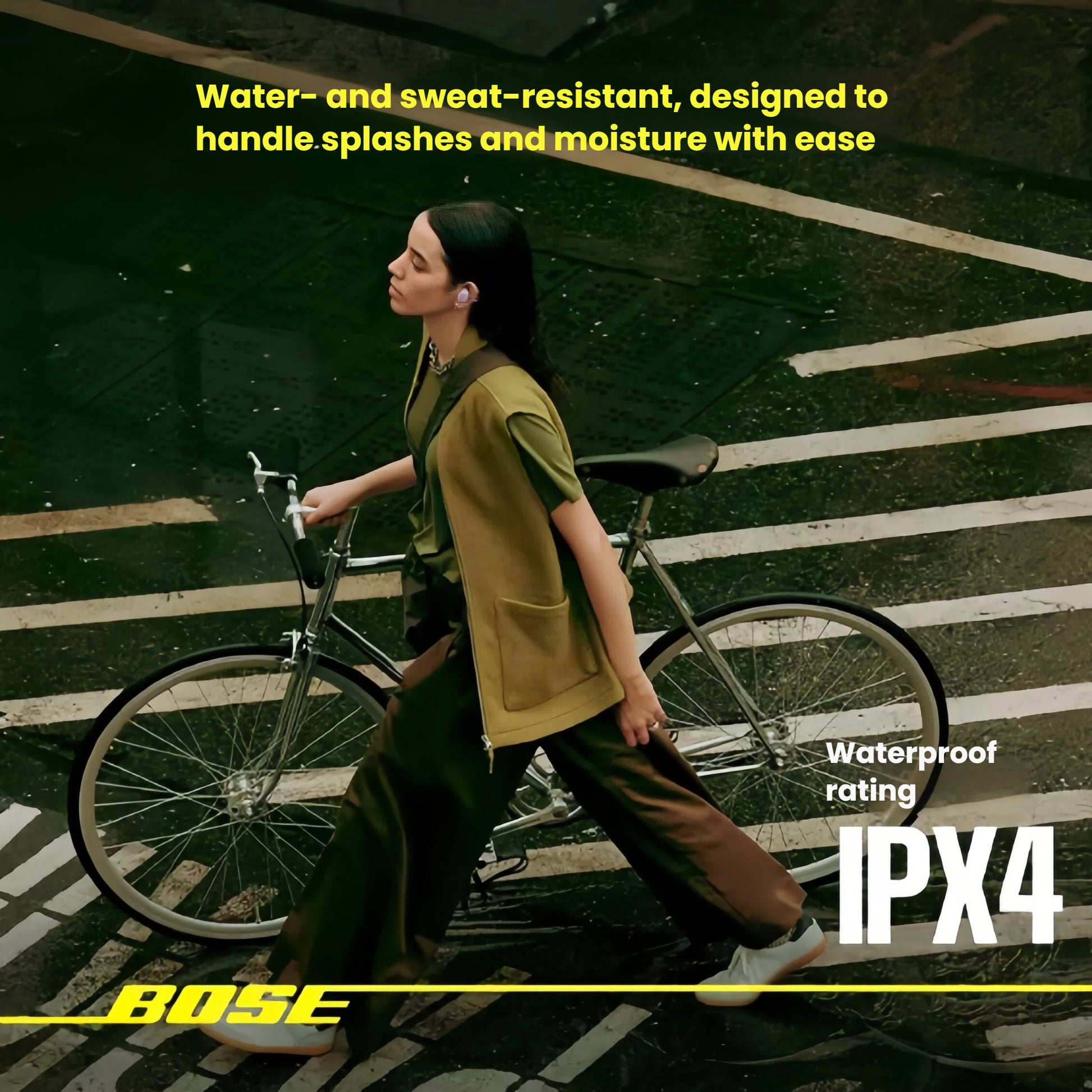 A woman with a bicycle wearing Bose QuietComfort Earbuds in a misty, urban setting, demonstrating their durability with an IPX4 rating for water and sweat resistance.