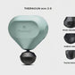 Sage green Theragun Mini 2.0 displayed with shock-absorbing, medium and thumb massage heads for targeted therapy.