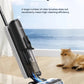 The Tineco iFLOOR U5 Stretch hard floor cleaner effortlessly cleaning up pet messes with its efficient single roller brush, demonstrating that more brushes don't always mean better performance. A cat is resting in the background.