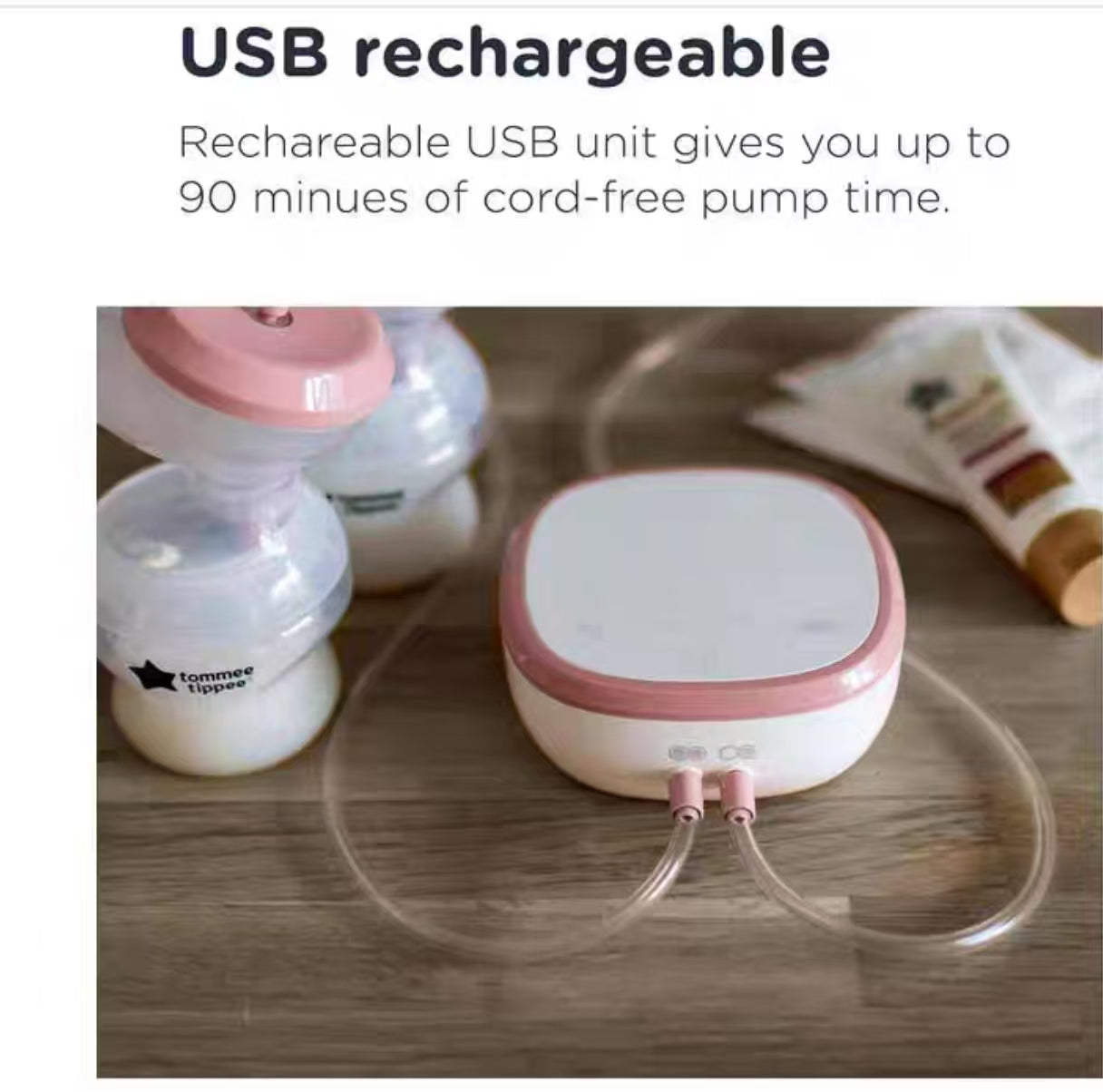 Close-up of Tommee Tippee electric breast pump motor unit with USB charging port and dual tubing connectors. Highlighting cord-free convenience and sleek white/pink design.