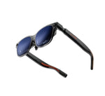 Studio shot of VITURE Luma Ultra XR glasses with blue electrochromic lenses and red-accented temples, showcasing sleek cyber design.