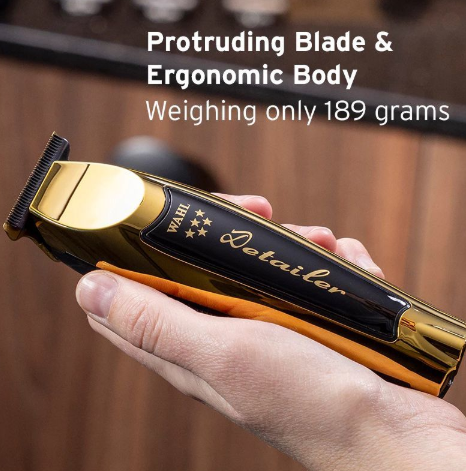 Wahl Detailer-Wide Trimmer in hand, demonstrating its ergonomic body and lightweight design.