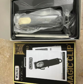 Open box of Wahl Hair Clipper with accessories neatly arranged, emphasizing the product's professional quality.