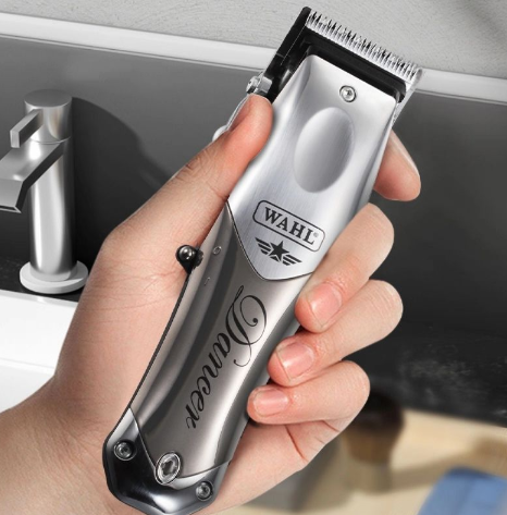 Wahl Launch Hair Clipper held in a hand, demonstrating its ergonomic design and size.