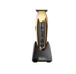 Wahl Professional 5-Star Series Detailer-Wide Trimmer on charging stand, highlighting its sleek design.