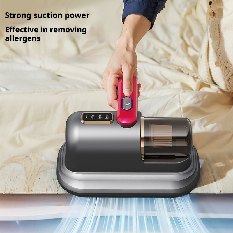 Image of a compact handheld vacuum cleaner in a dark grey and magenta color scheme. The vacuum features a transparent dustbin and a simple control panel on top of the handle. The design is sleek and minimalistic, suitable for efficiently cleaning small areas or furniture