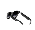 Studio shot of folded black XREAL Air 2 AR glasses, highlighting sleek, travel-ready design.