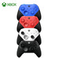 Stack of Xbox Elite Series 2 wireless controllers in blue, red, white, and black finishes, showcasing color options for gamers.