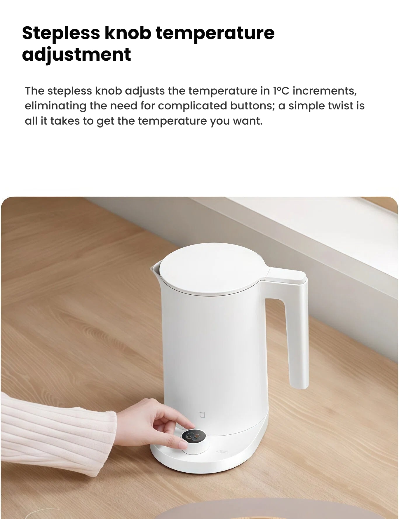 A close-up of a hand adjusting the stepless knob on the Xiaomi Smart Kettle 2 Pro's base, which allows for precise temperature adjustment in 1-degree inc[2][4][5]rements for perfect coffee and tea.