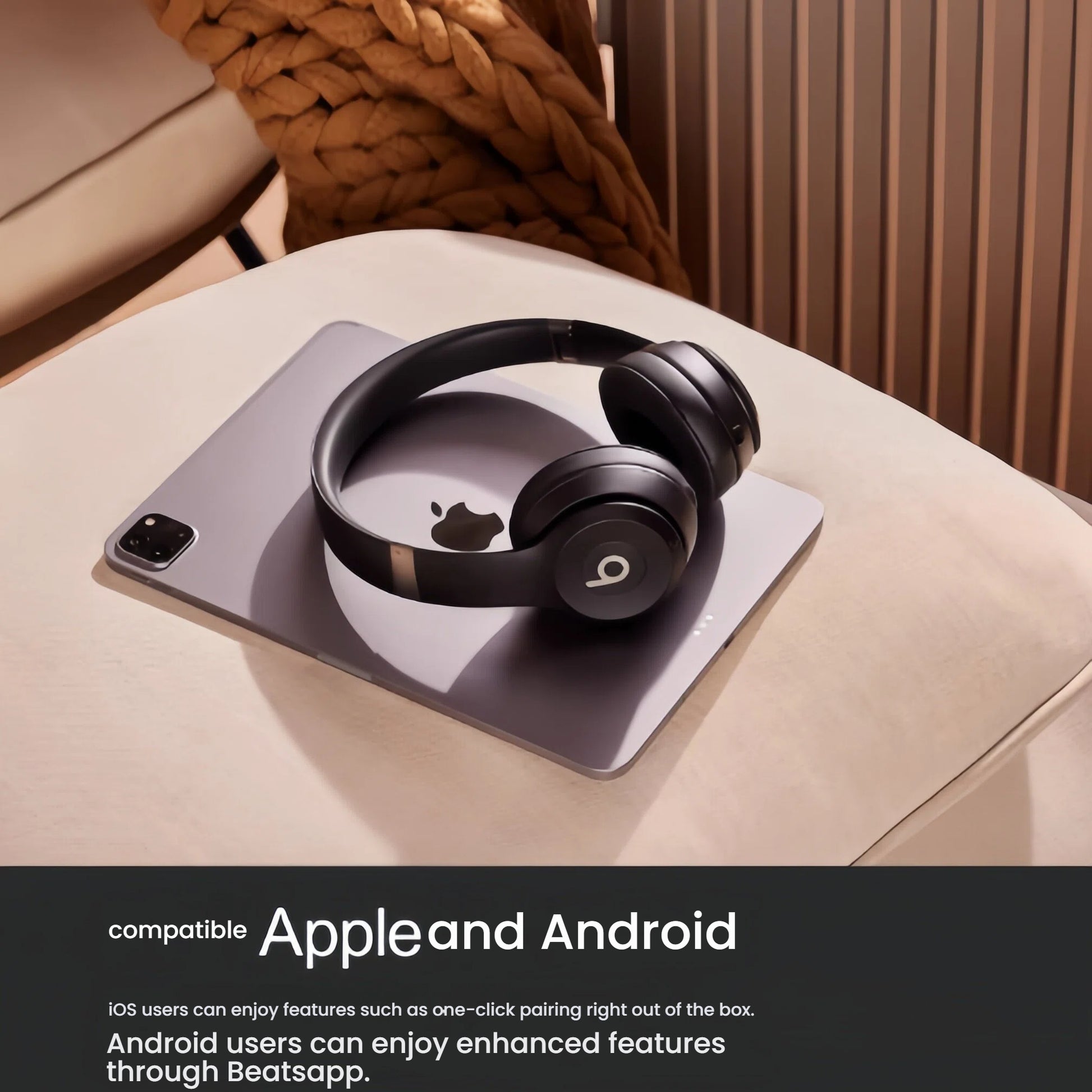 Black Beats Solo 4 headphones resting on an iPad to highlight seamless compatibility with both Apple and Android devices for easy pairing and enhanced features.