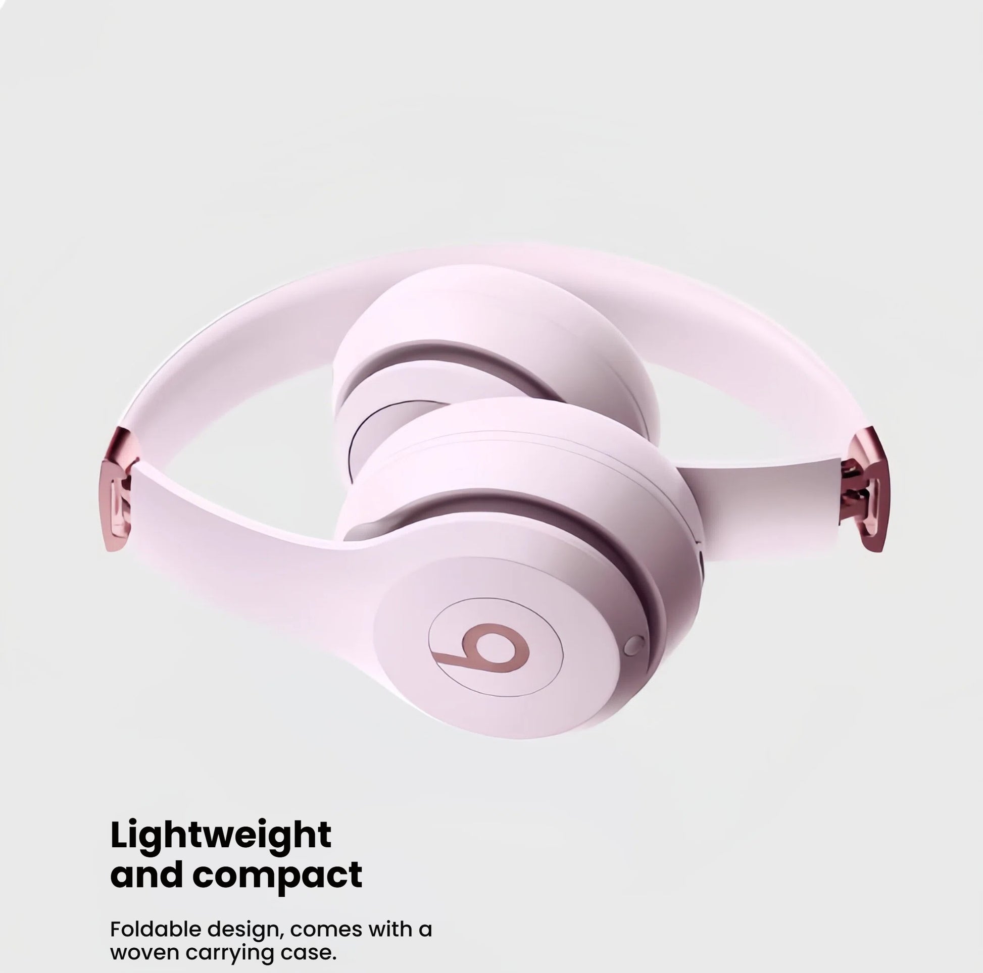Pink Beats Solo 4 wireless on-ear headphones folded to showcase their lightweight, compact, and portable design, ideal for travel.
