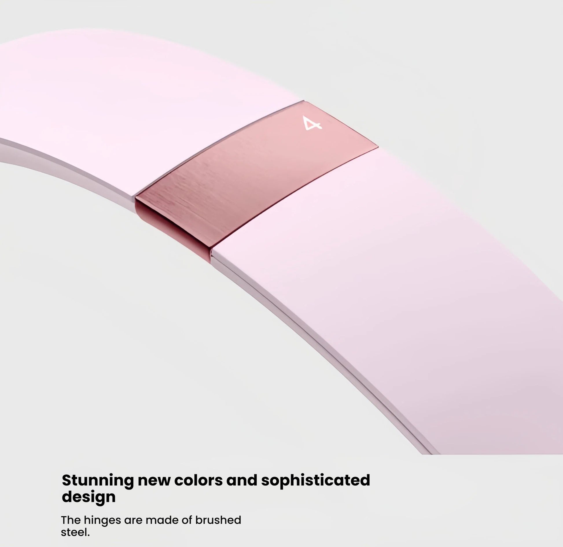 A close-up shot of the pink Beats Solo 4's brushed steel hinge, emphasizing the sophisticated design and premium build quality of the headphones.