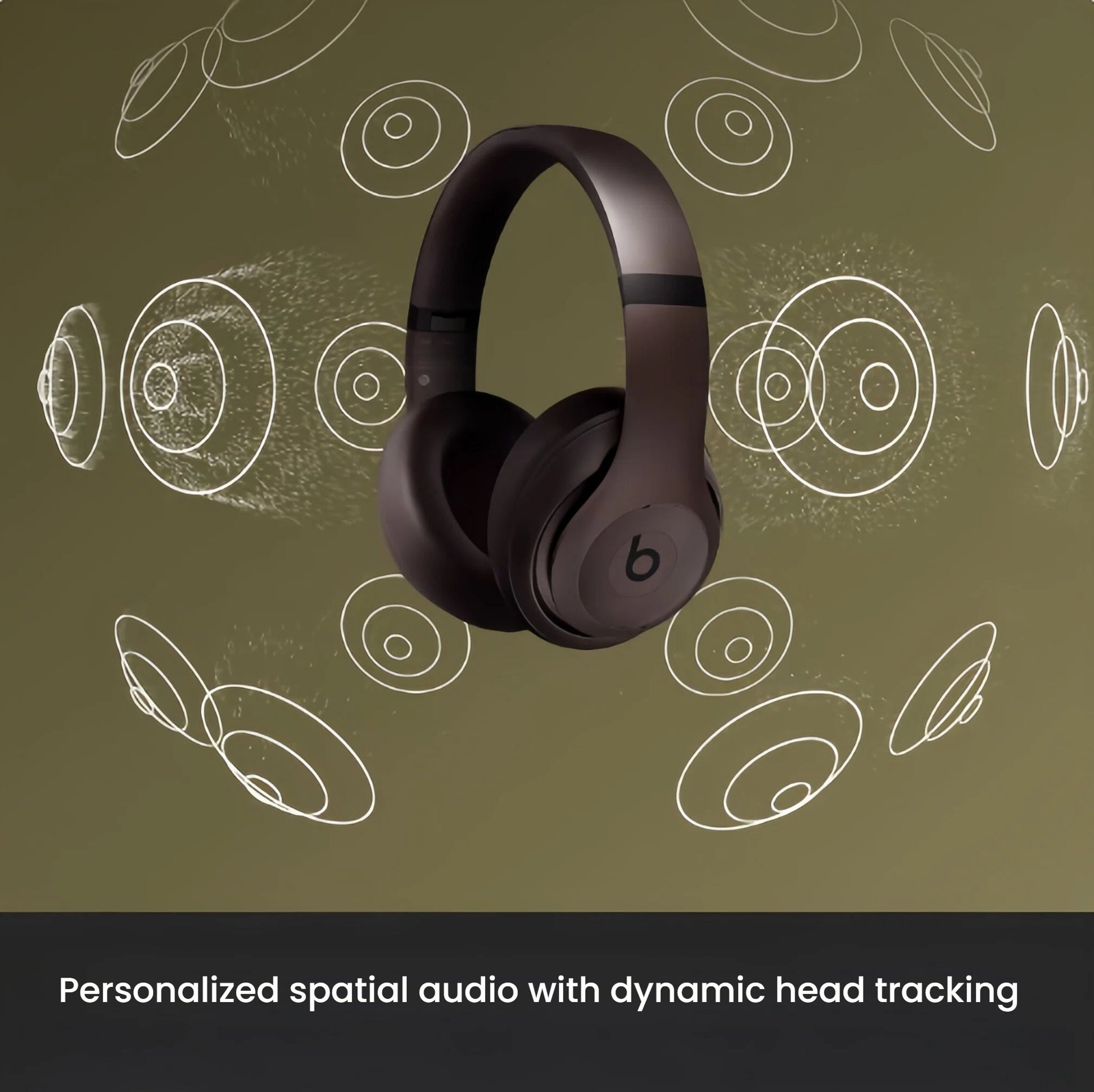 Dark brown Beats Studio Pro headphones demonstrating Personalized Spatial Audio with dynamic head tracking through surrounding soundwave graphics.