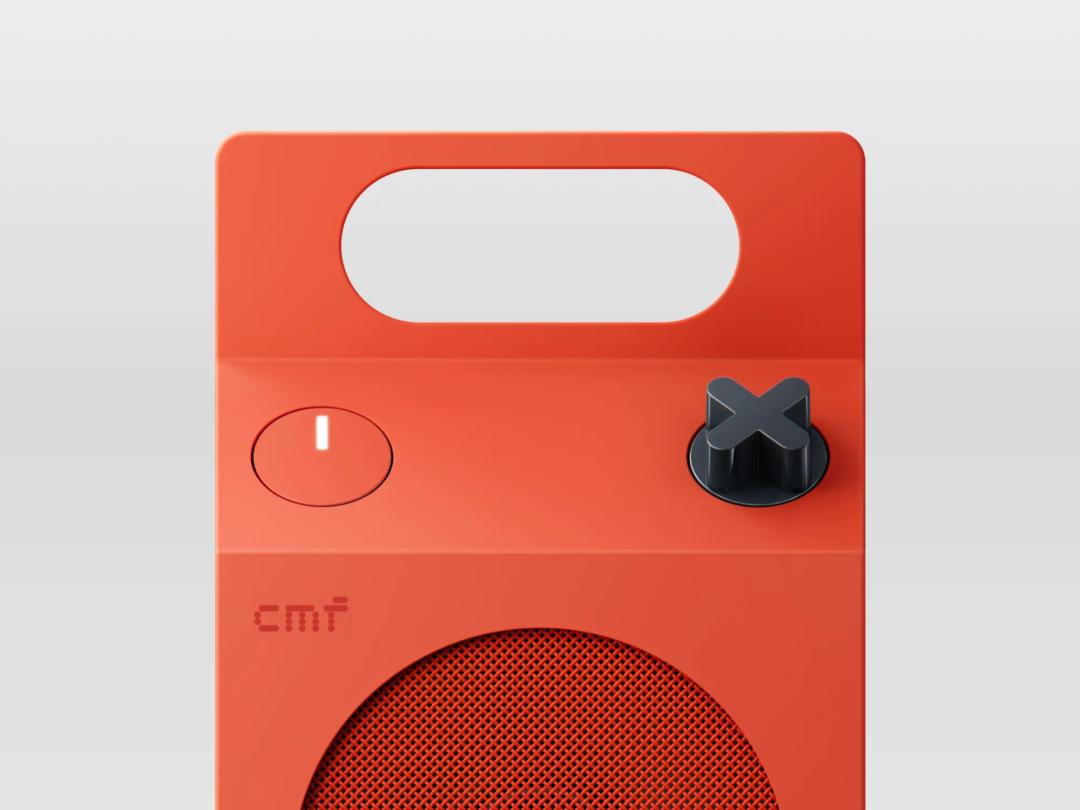 CMF Speaker M orange front panel, power button and rotary playback knob