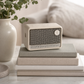 Edifier ES20 ivory Bluetooth speaker beside books