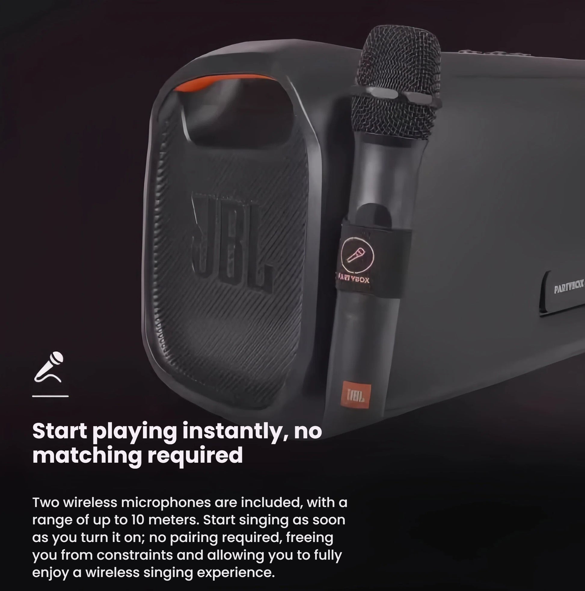 A close-up of the JBL PartyBox On-The-Go Essential with an included wireless microphone attached, demonstrating the instant-play feature with no pairing required.