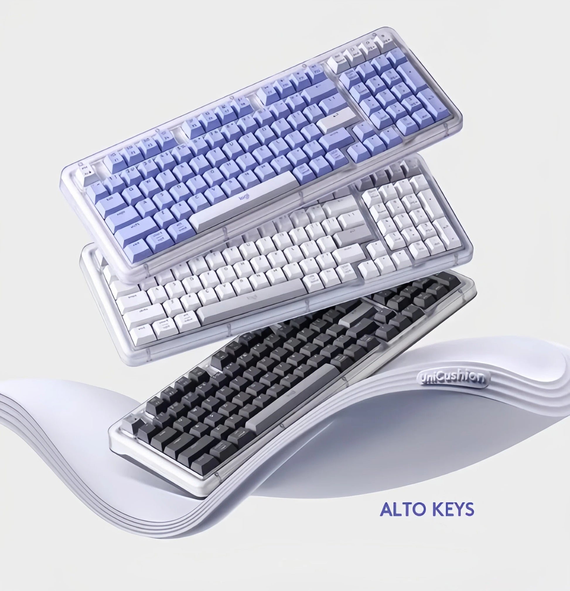 A promotional image showing all three colors of the Logitech Alto Keys K98M wireless keyboard—black, white, and blue—stacked together to highlight the UniCushion design.