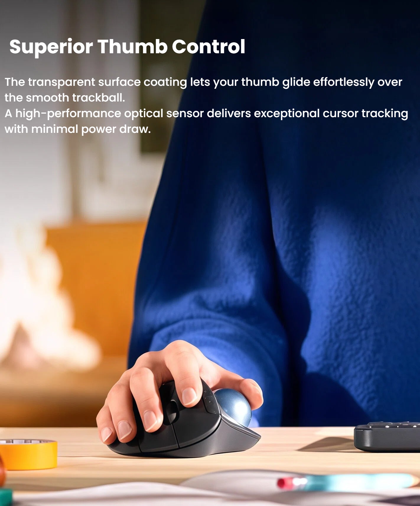  Close-up detail of a thumb operating the smooth trackball on the Logitech M575S, featuring a high-performance optical sensor for superior cursor control.