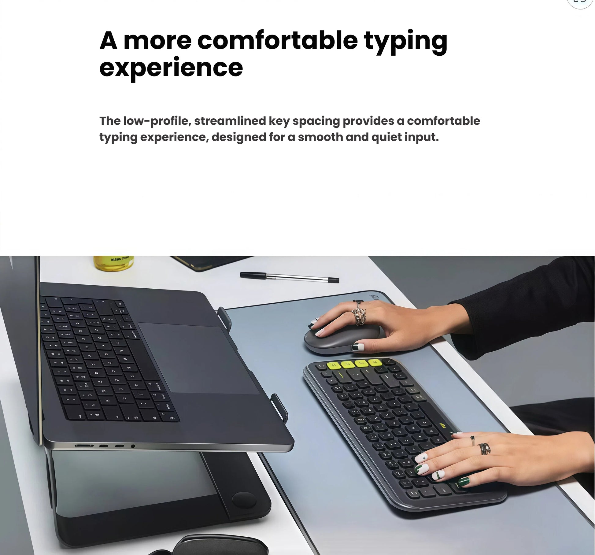 Close-up of hands typing on a graphite Logitech POP Icon Keys keyboard, illustrating the comfortable, smooth, and quiet typing experience of the low-profile keys.