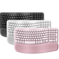 The Logitech Wave Keys wireless ergonomic keyboard shown in three available colors: graphite black, off-white, and rose pink.