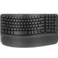 Top-down view of the graphite Logitech Wave Keys wireless ergonomic keyboard, featuring a wave-shaped key layout and integrated cushioned palm rest.