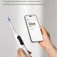 A user holding the usmile Y20 PRO toothbrush while using the companion smartphone app to set up personalized and customizable voice prompts for guided brushing.