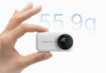 White LEAPTIC Cube camera core held between fingers, showing its compact 55.9g design