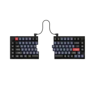 Top view of Keychron Q11 split mechanical keyboard featuring full QWERTY layout, red escape and enter keys, black PCB, and dual wired connection against a clean white background.